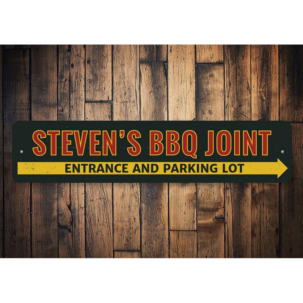 A decorative BBQ Joint Directional Sign made of high-quality aluminum, featuring customizable text and pre-drilled holes for easy mounting.