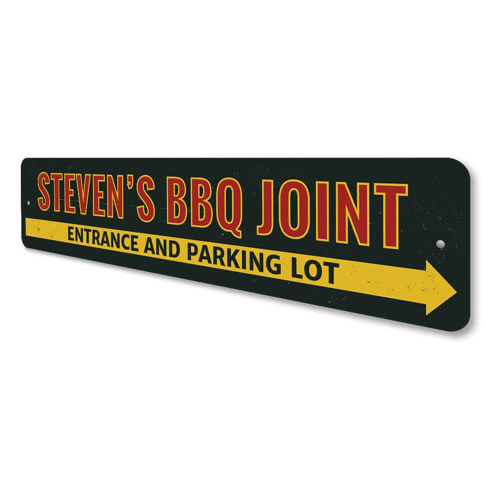 A decorative BBQ Joint Directional Sign made of high-quality aluminum, featuring customizable text and pre-drilled holes for easy mounting.