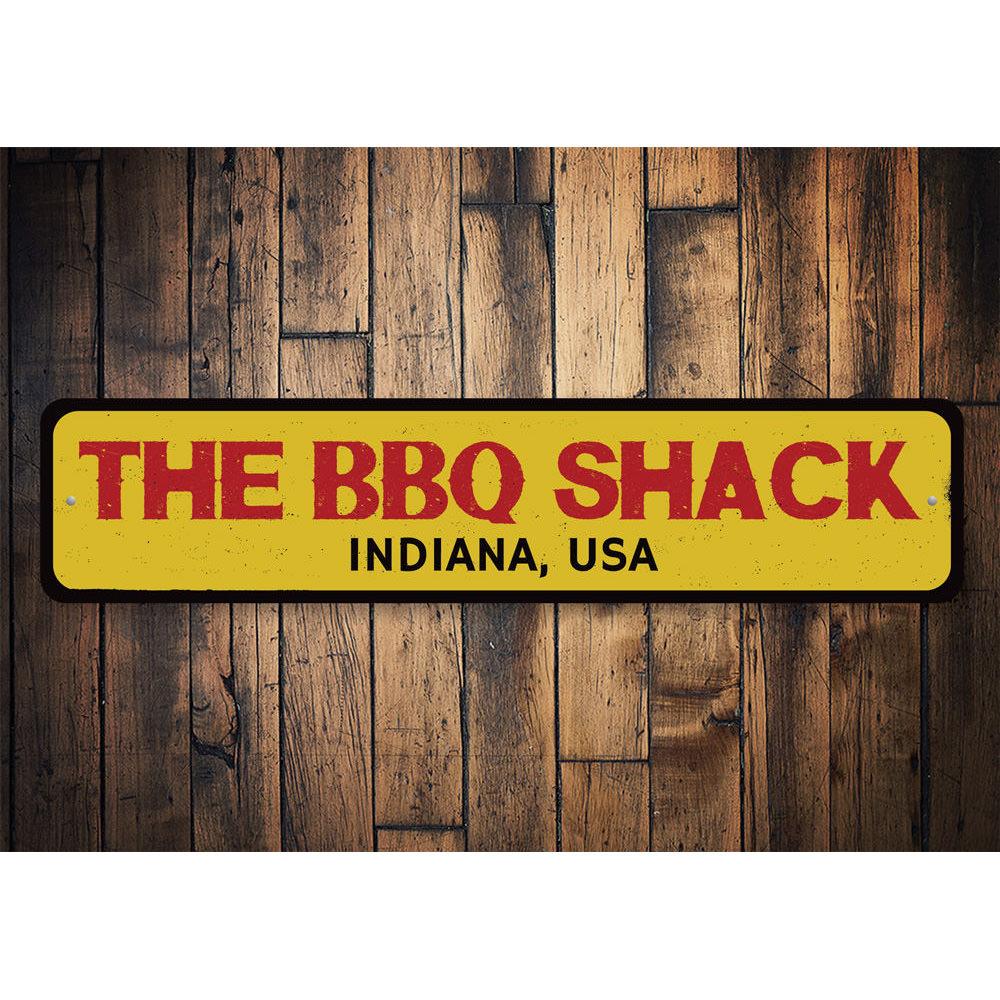 A customizable BBQ Shack Location Sign made of high-quality aluminum, featuring pre-drilled holes for easy mounting, perfect for restaurants and cafes.