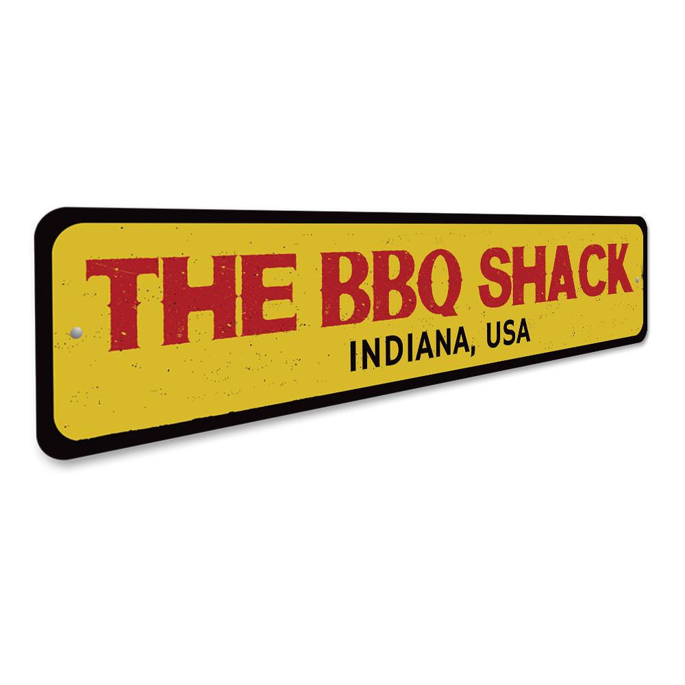 A customizable BBQ Shack Location Sign made of high-quality aluminum, featuring pre-drilled holes for easy mounting, perfect for restaurants and cafes.