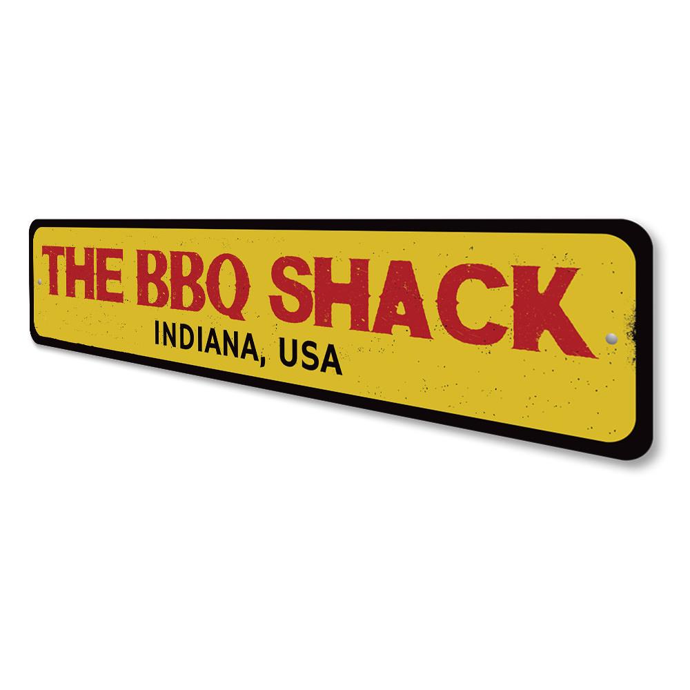 A customizable BBQ Shack Location Sign made of high-quality aluminum, featuring pre-drilled holes for easy mounting, perfect for restaurants and cafes.