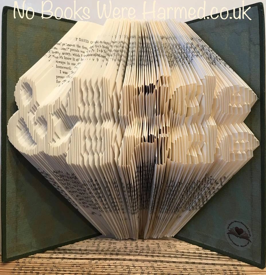 Handcrafted Bride & Bride art made from vintage books, showcasing unique folded pages in various colors.