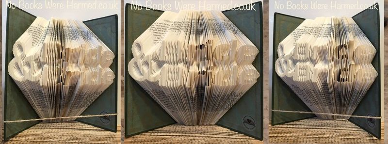 Handcrafted Bride & Bride art made from vintage books, showcasing unique folded pages in various colors.