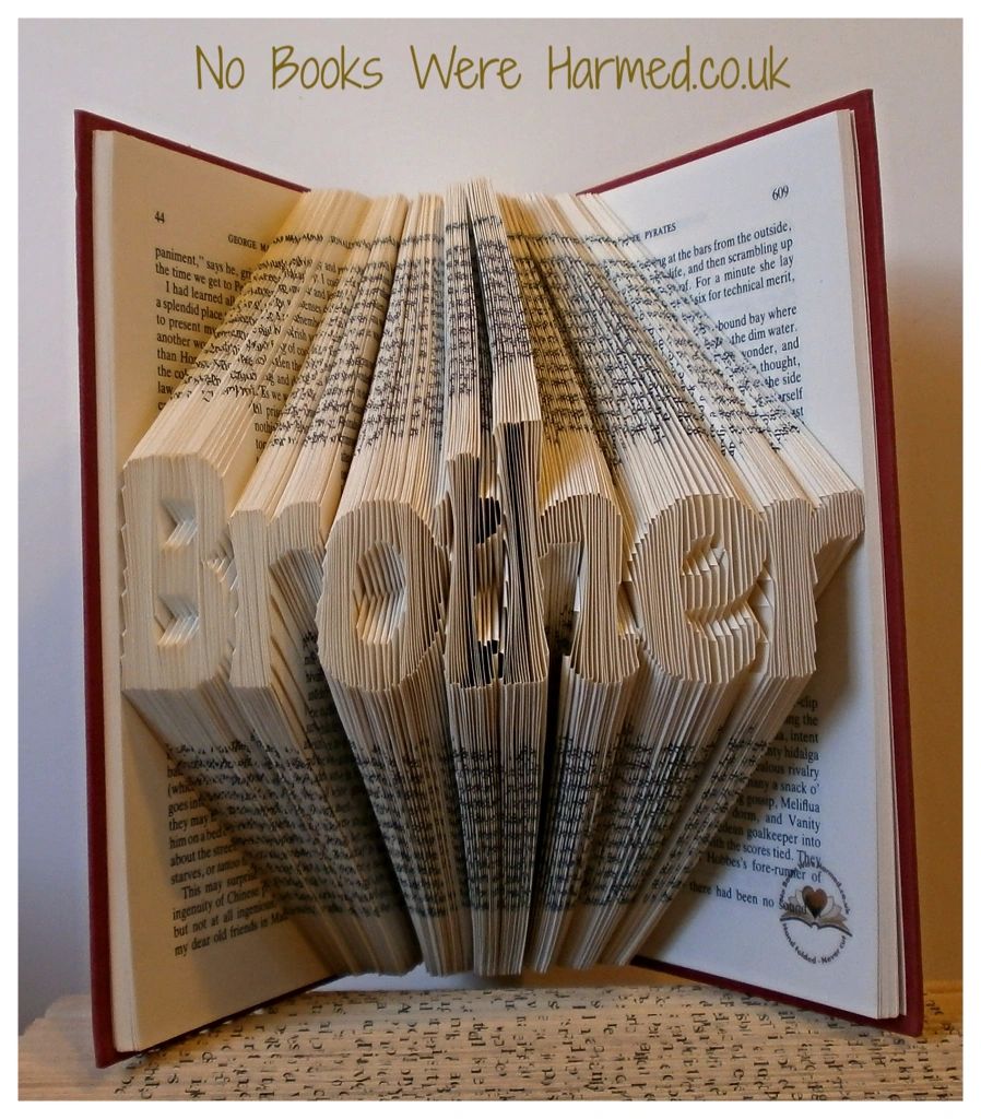 A unique hand-folded book art piece titled Brother, crafted from reclaimed vintage books, showcasing intricate folds and textures.