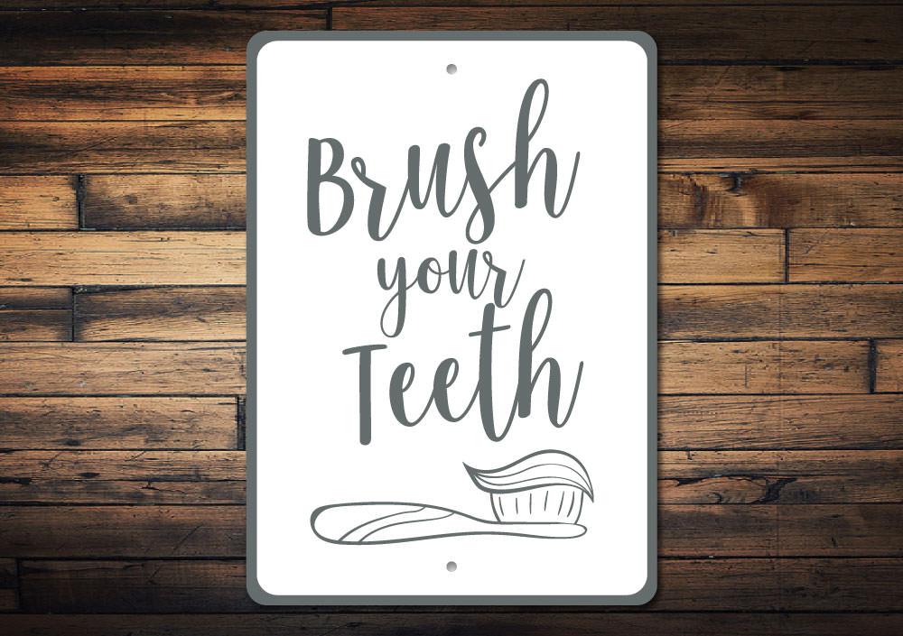 A decorative Brush Your Teeth Sign made of high-quality aluminum, featuring a vibrant design suitable for home decor.