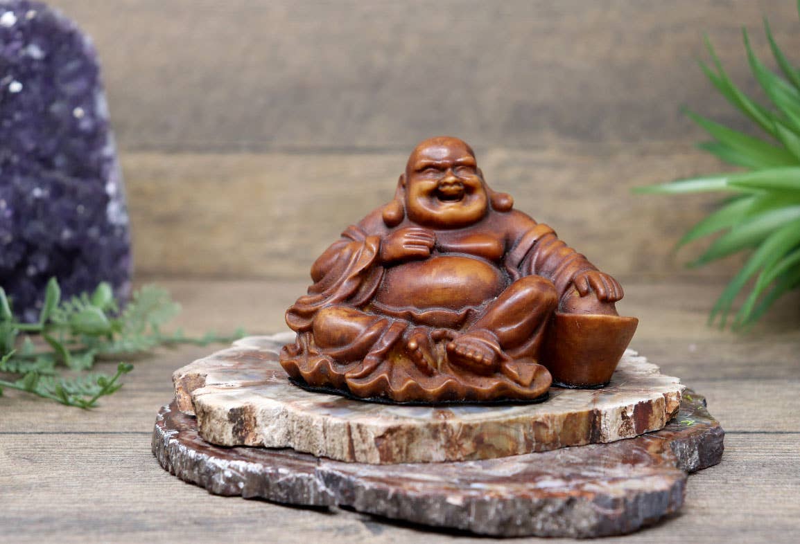 Mini Laughing Buddha made of resin, symbolizing peace and wisdom, standing 2.5 inches tall, sourced from Indonesia.