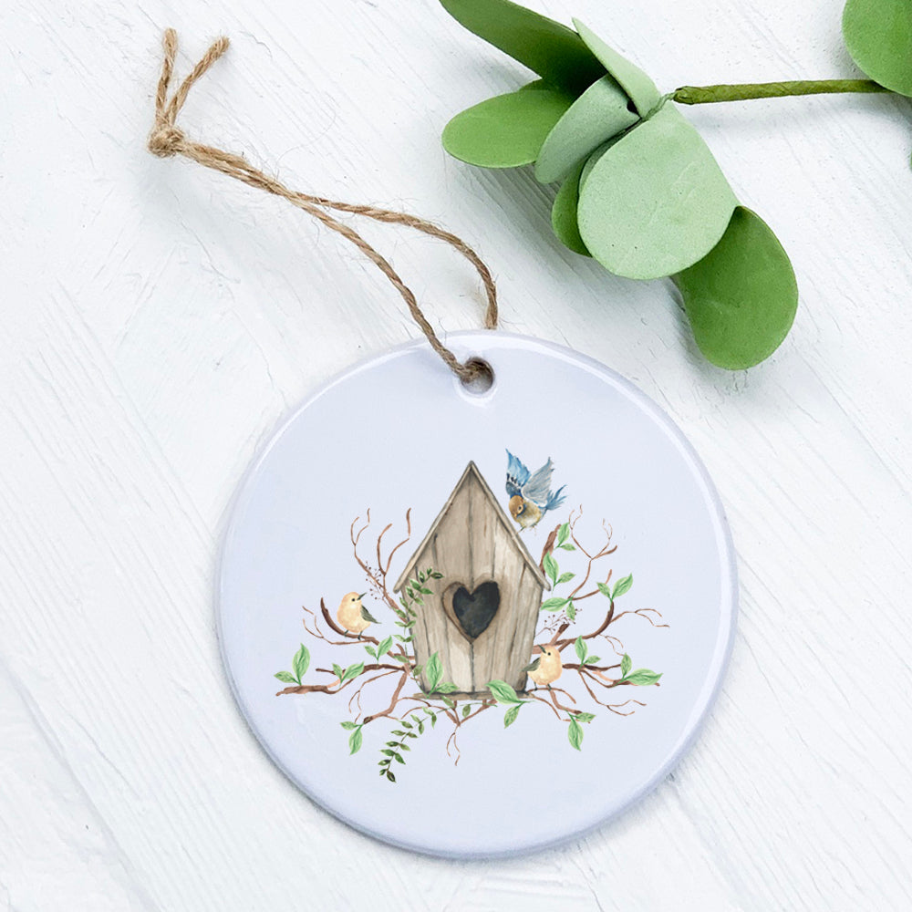 Budding Birdhouse Ornament made of high-quality porcelain with a vibrant design, perfect for gifting or home decor.