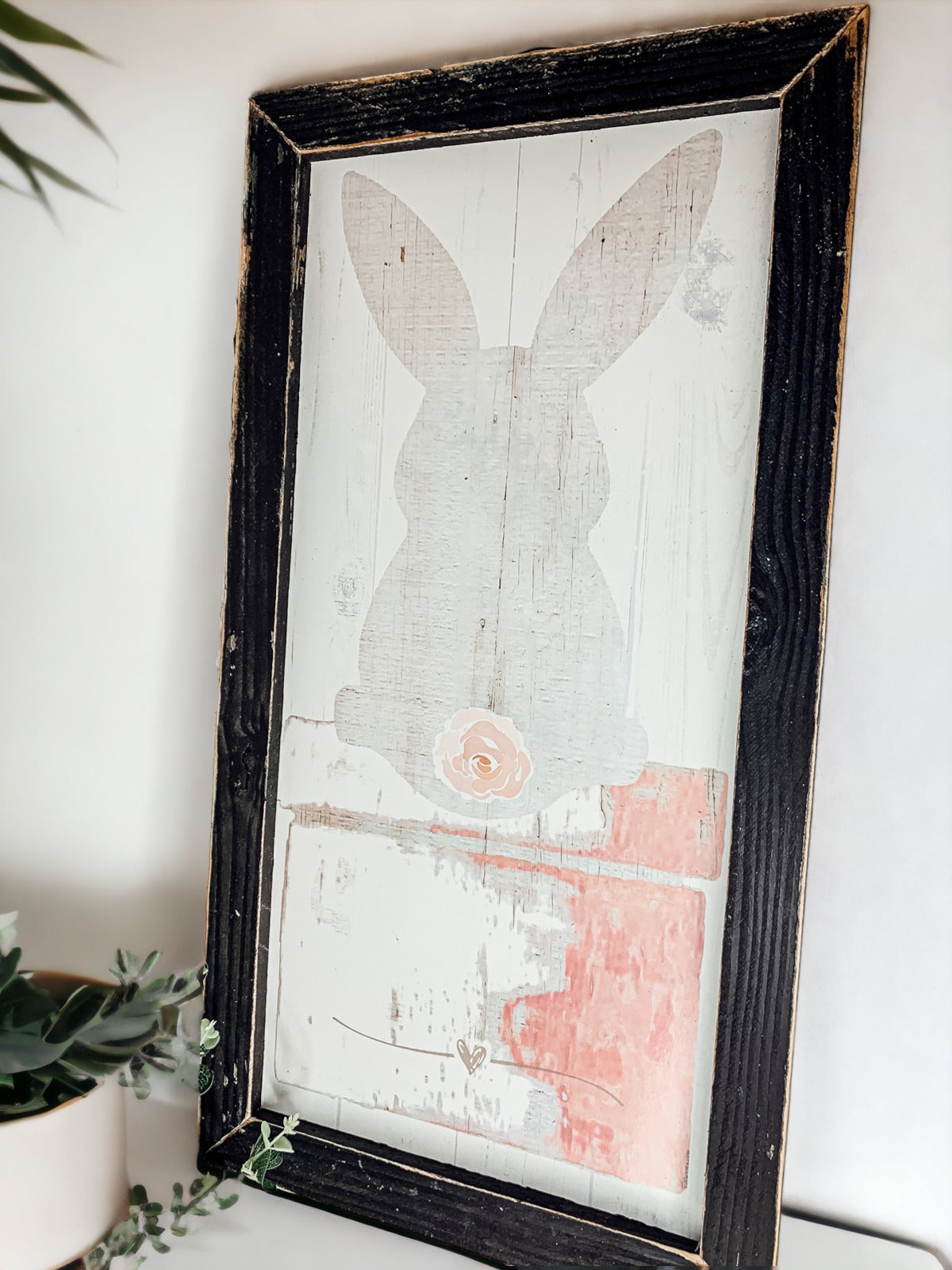 Rustic Bunny Tail sign framed in black, featuring a vintage design perfect for spring decor.