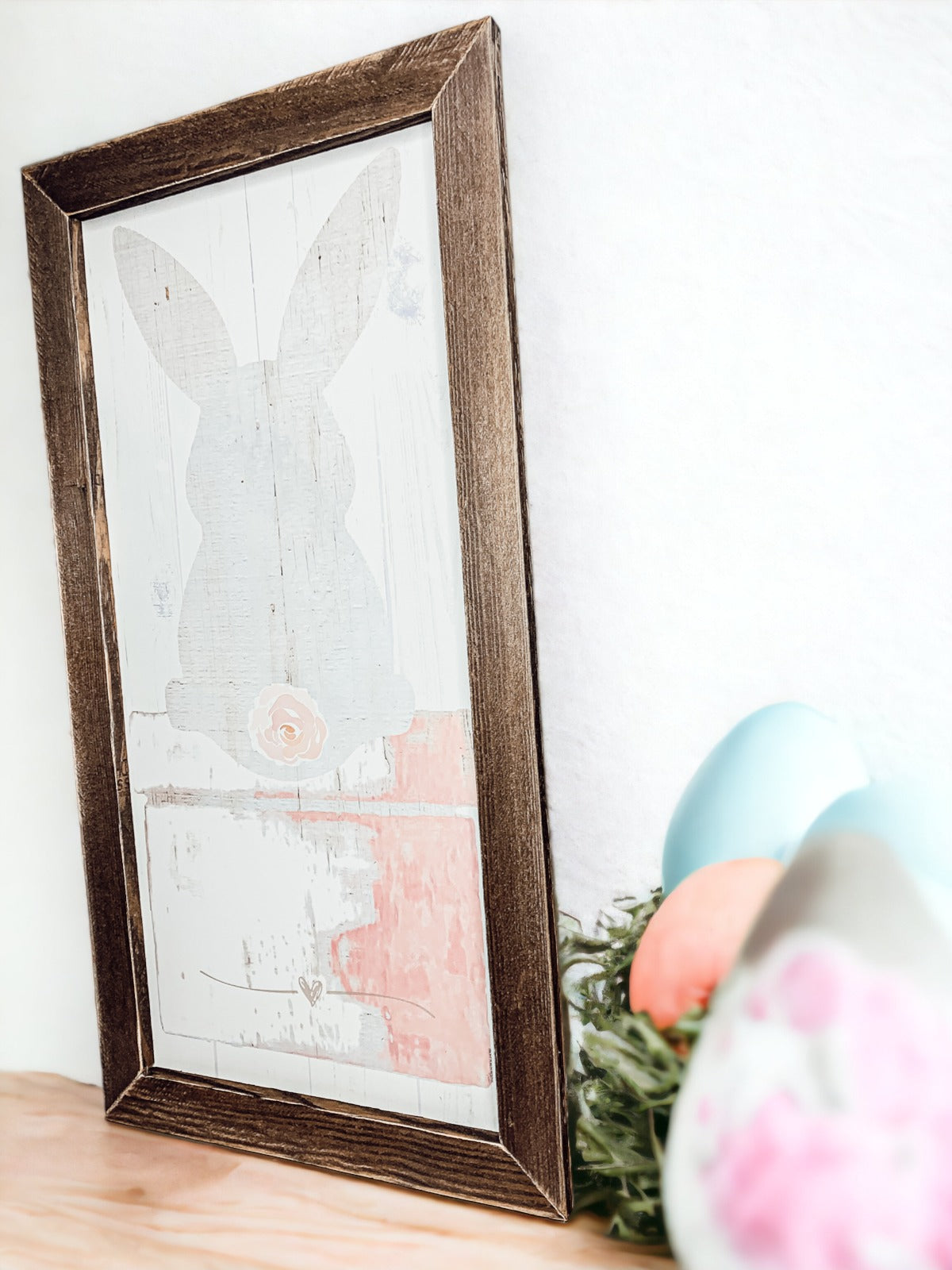 Rustic Bunny Tail sign framed in black, featuring a vintage design perfect for spring decor.