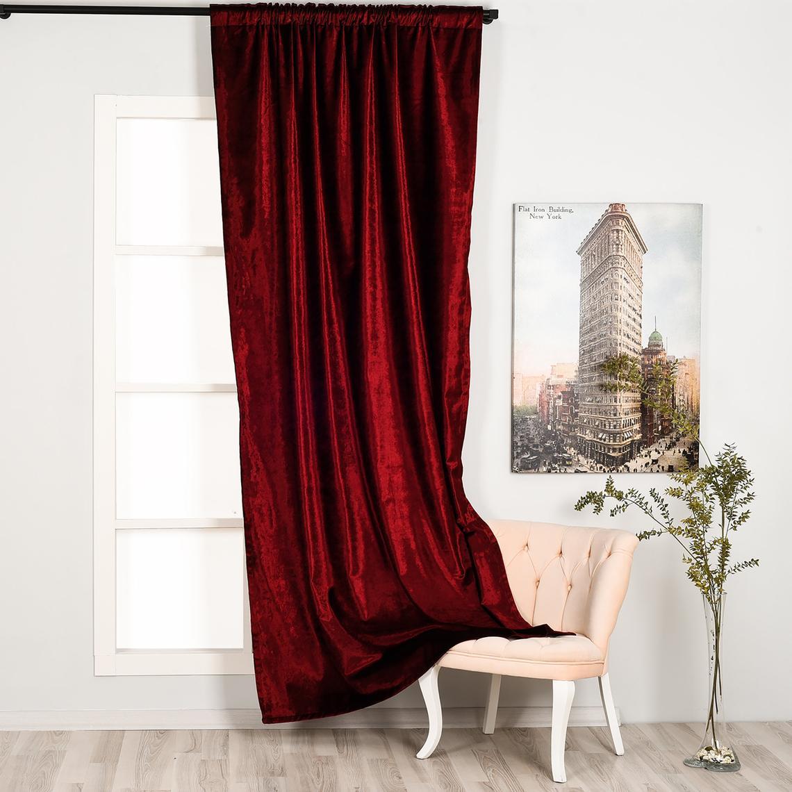 Burgundy Luxury Velvet Curtain hanging elegantly in a stylish room, showcasing its rich color and soft texture.