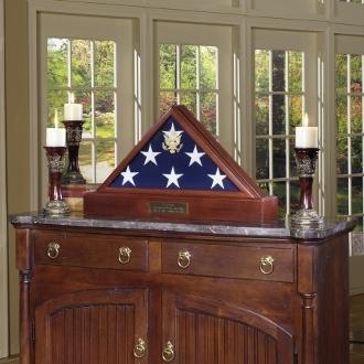 American Made Burial Flag Display Case in solid walnut with beveled glass and gold Great Seal, showcasing a burial flag.