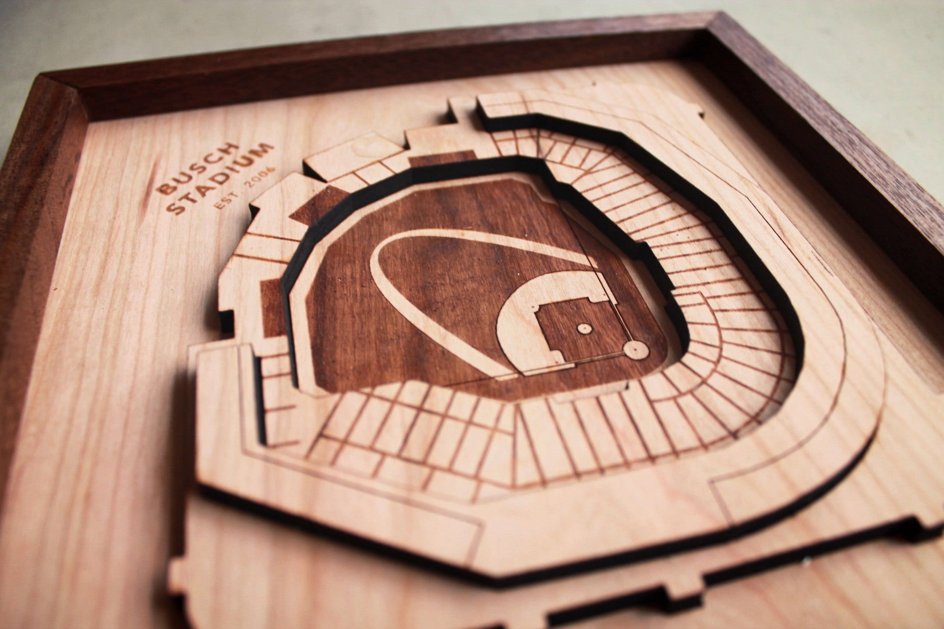 Laser engraved Busch Stadium art piece featuring the St. Louis Arch, crafted from solid cherry wood with a black walnut frame.