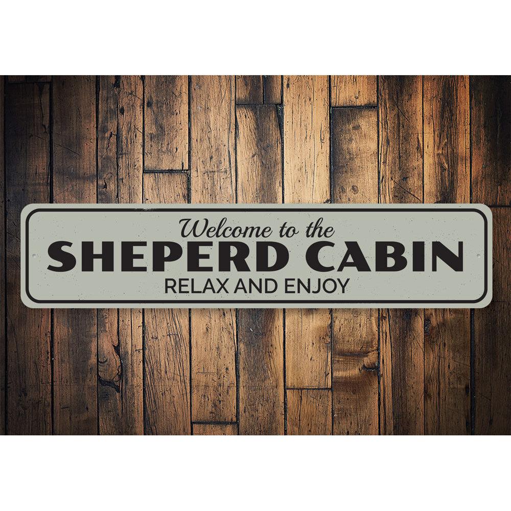 A decorative Cabin Relax & Enjoy Sign made of high-quality aluminum, featuring a rustic design perfect for lakeside homes.