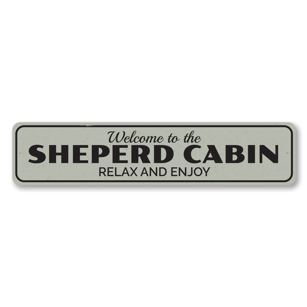 A decorative Cabin Relax & Enjoy Sign made of high-quality aluminum, featuring a rustic design perfect for lakeside homes.