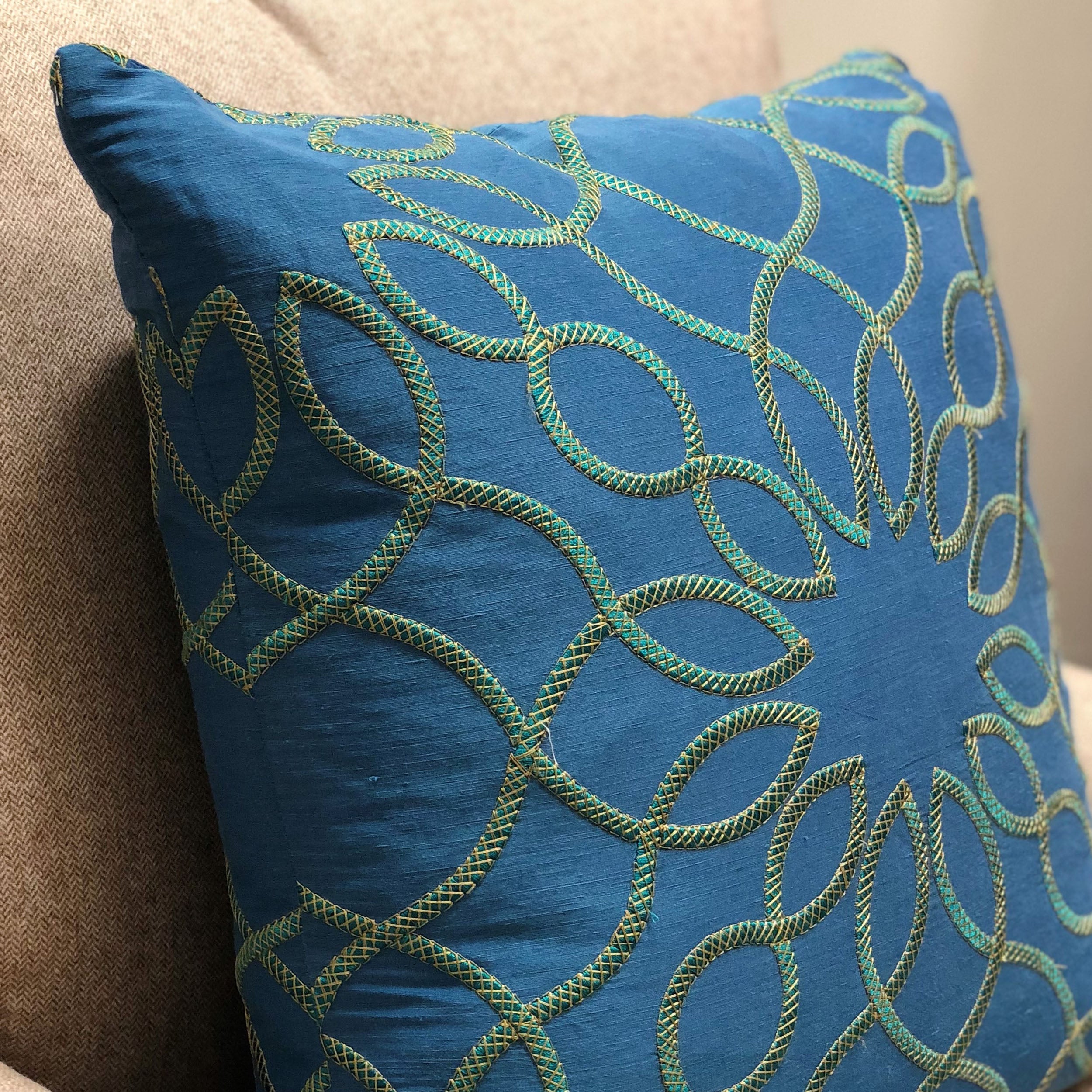 Calico Island Blue and Green Geometric Luxury Throw Pillow showcasing a vibrant geometric pattern in blue and green, made from a luxurious fabric blend.