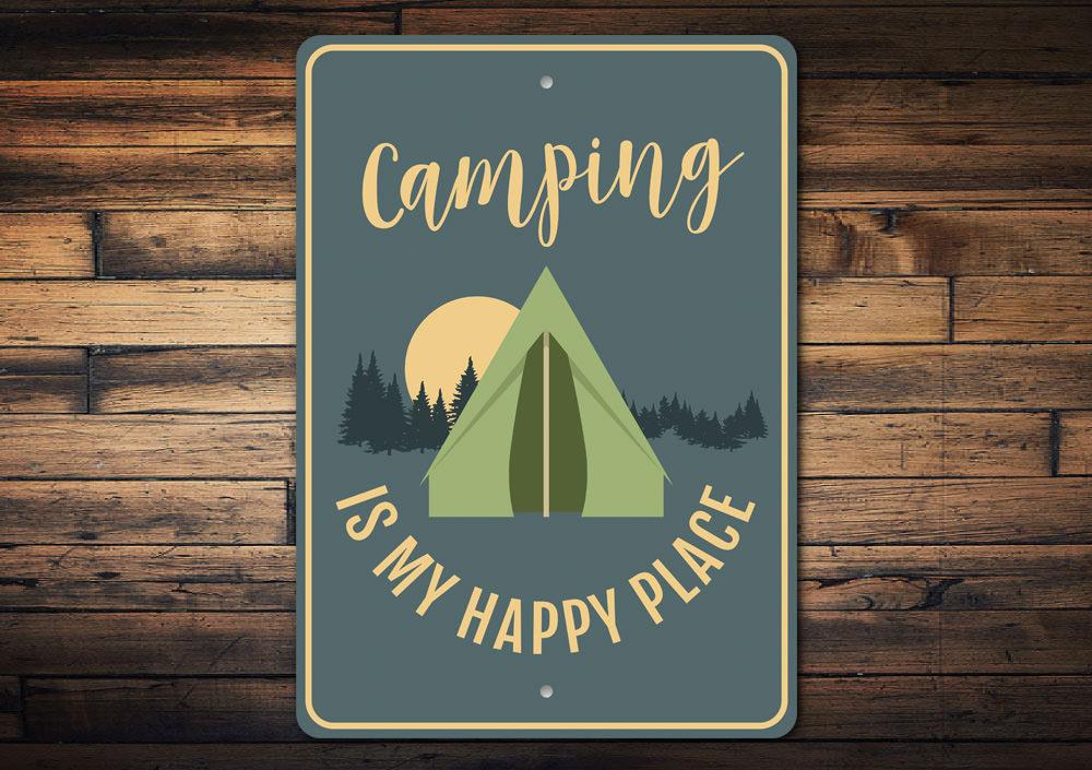 A decorative metal sign that reads 'Camping is My Happy Place', showcasing a rustic design perfect for outdoor enthusiasts.