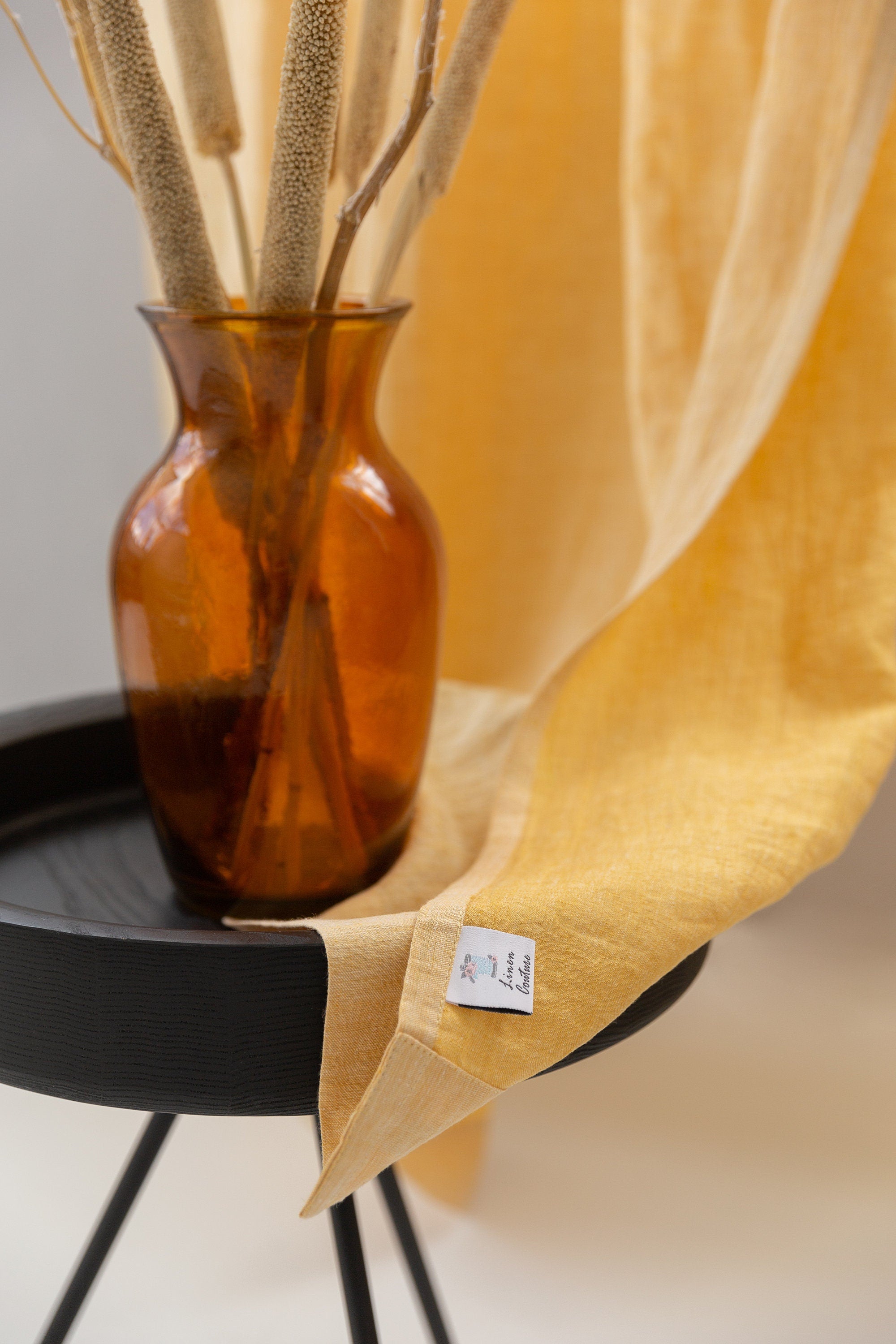 Canary Yellow linen curtain with pleating tape hanging elegantly, showcasing its semi-sheer texture and modern design.