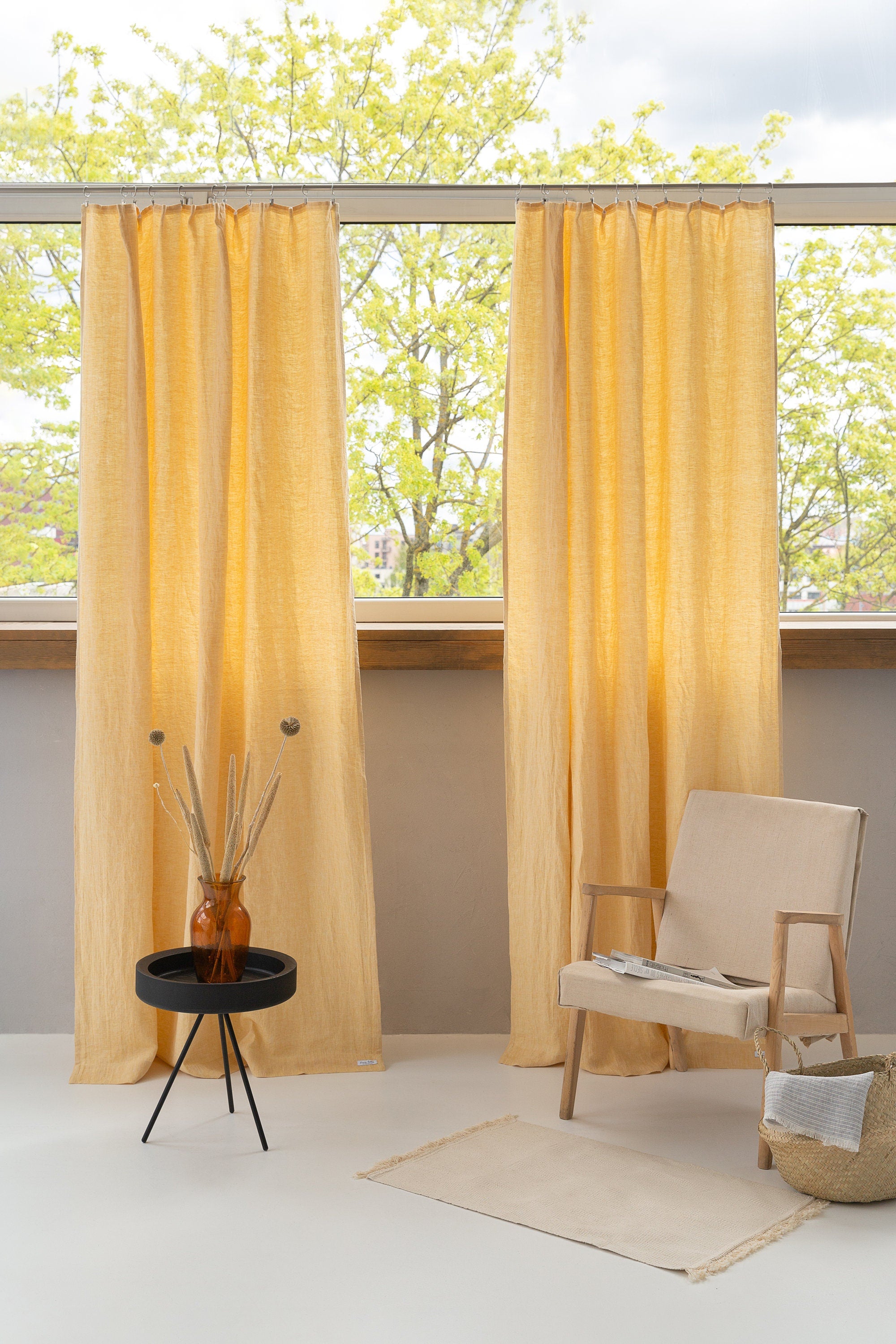 Canary Yellow linen curtain with pleating tape hanging elegantly, showcasing its semi-sheer texture and modern design.