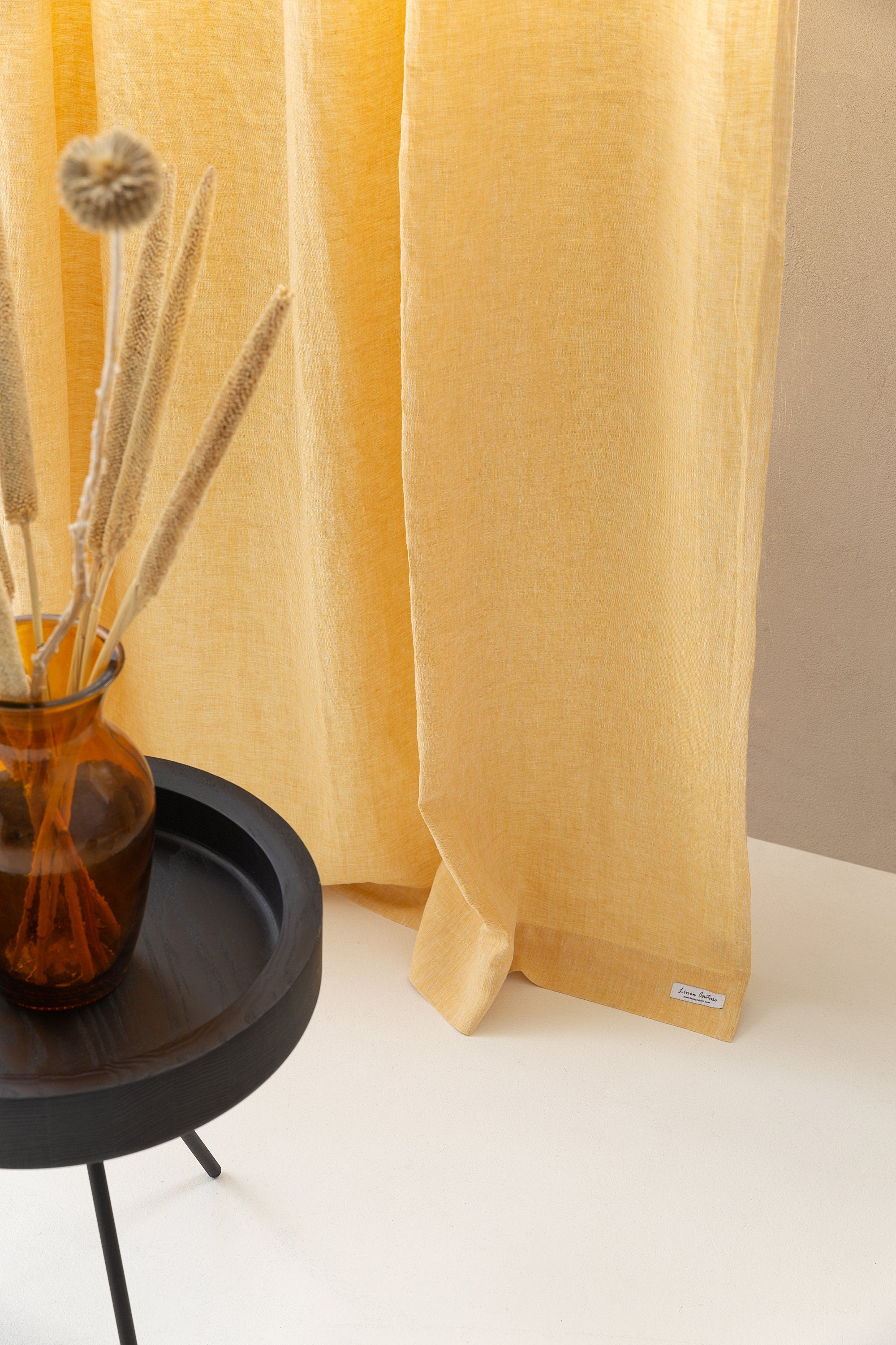 Canary Yellow linen curtain with pleating tape hanging elegantly, showcasing its semi-sheer texture and modern design.