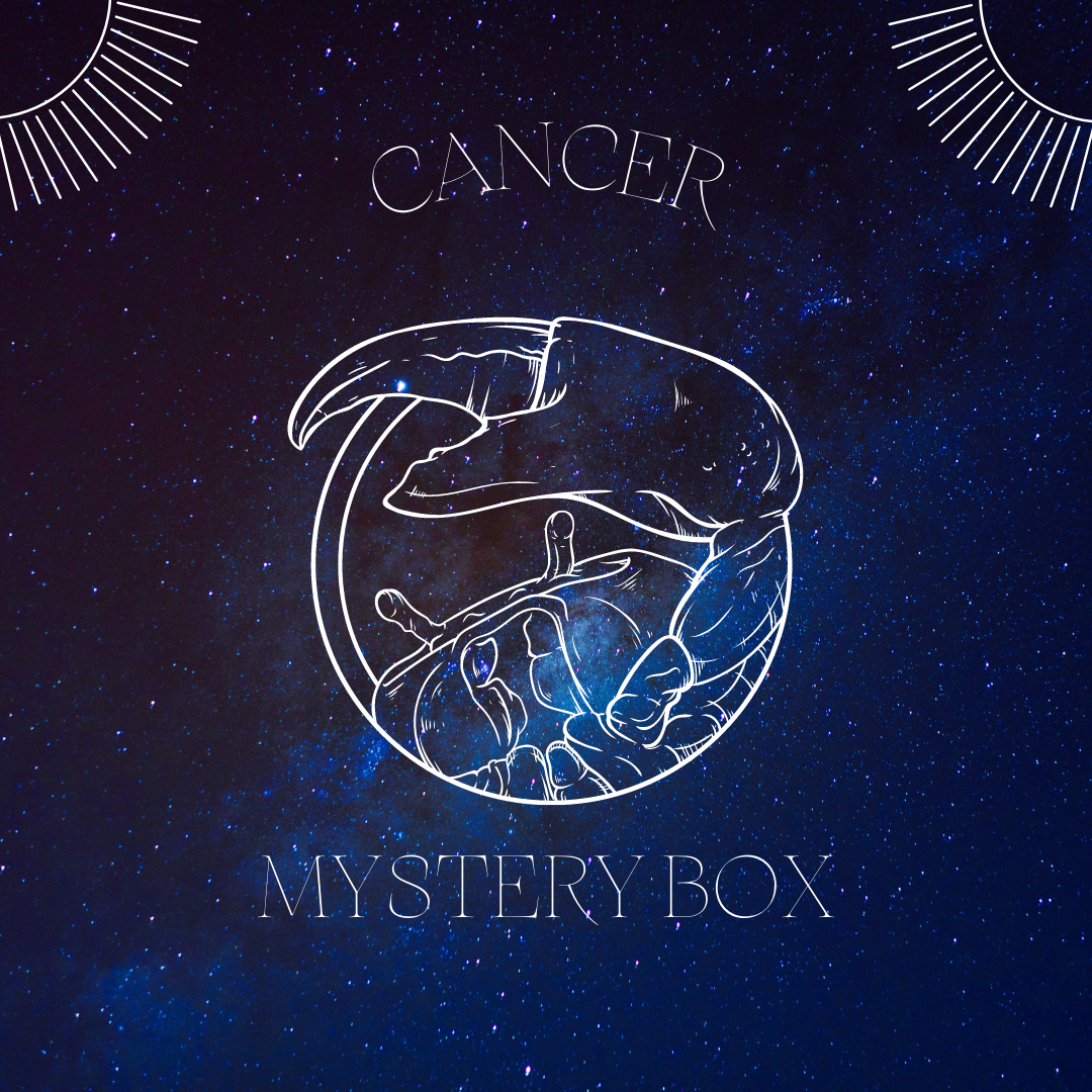 A beautifully arranged Cancer Mystery Box featuring various crystals, sage, and candles, tailored for the Cancer zodiac sign.