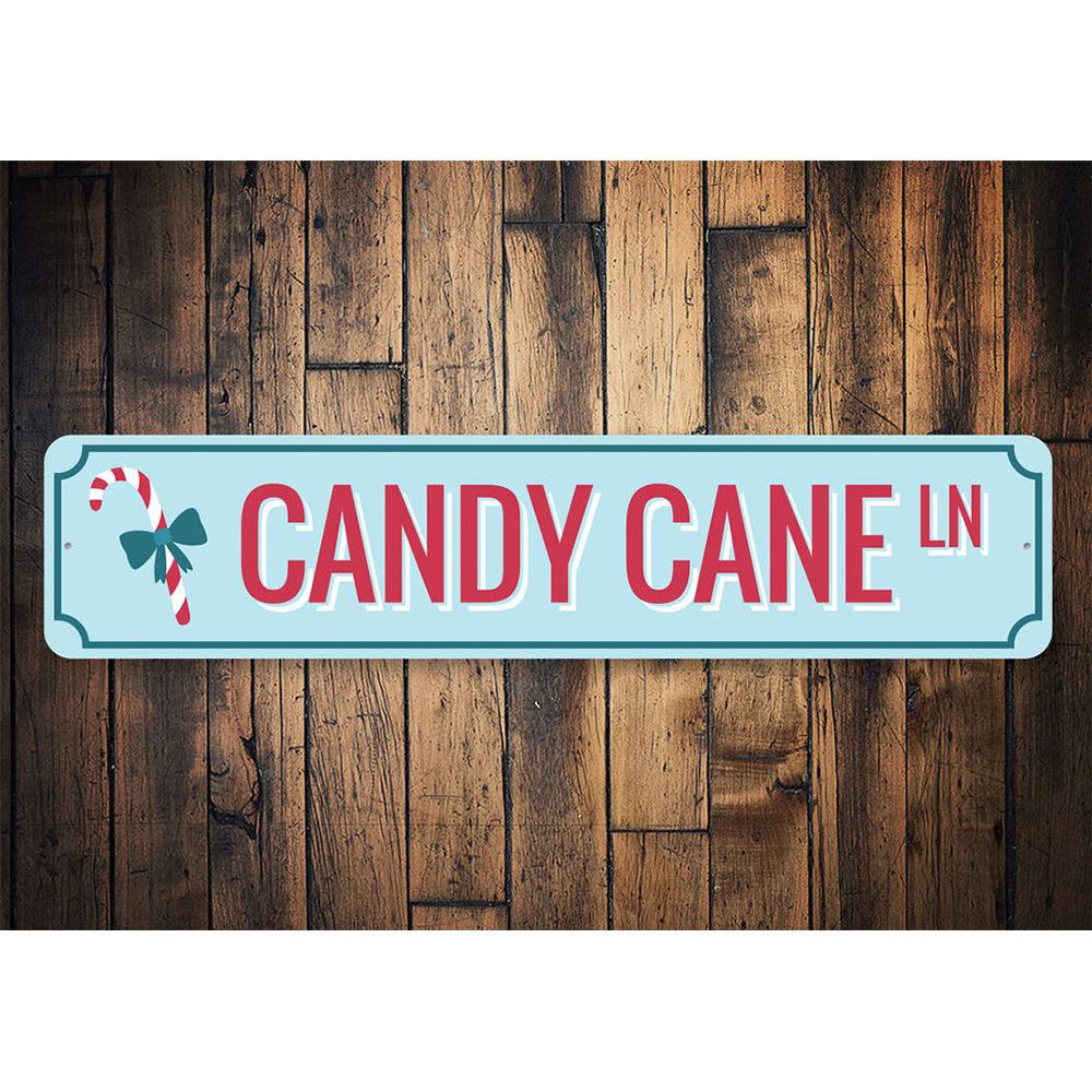 Candy Cane Ln Lane Holiday Sign featuring festive colors and charming design, perfect for Christmas decorations.