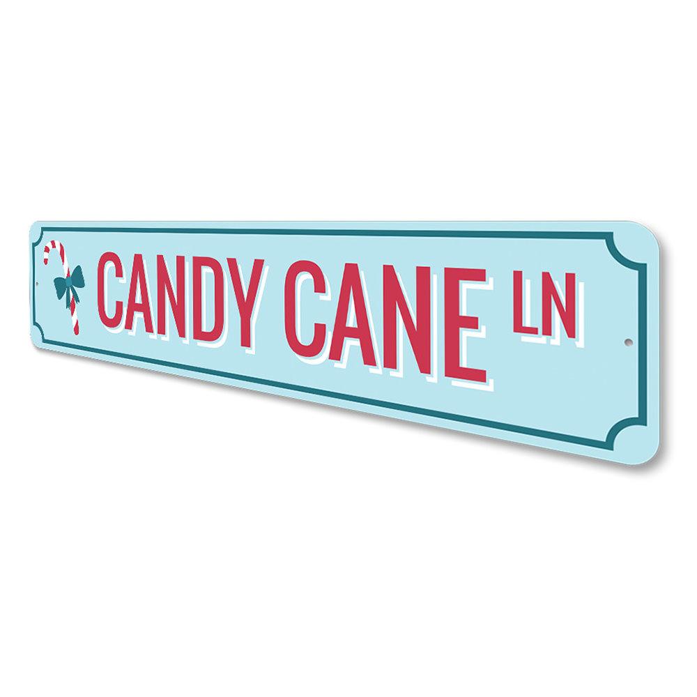 Candy Cane Ln Lane Holiday Sign featuring festive colors and charming design, perfect for Christmas decorations.