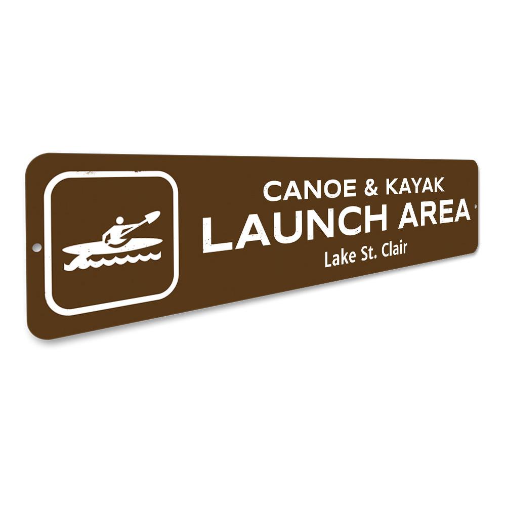 Canoe & Kayak Launch Area Sign made of durable aluminum, featuring customizable text and pre-drilled holes for easy mounting.