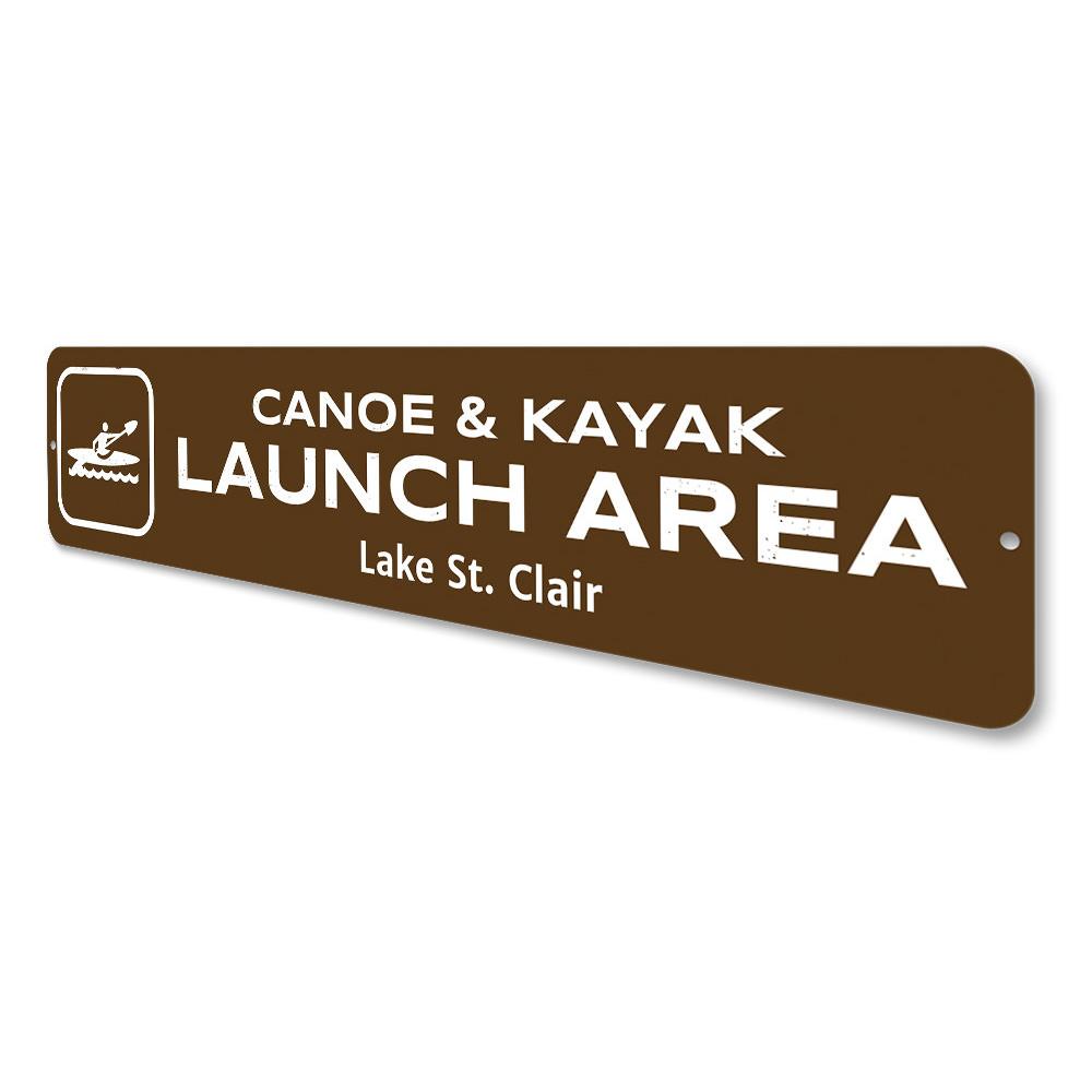 Canoe & Kayak Launch Area Sign made of durable aluminum, featuring customizable text and pre-drilled holes for easy mounting.