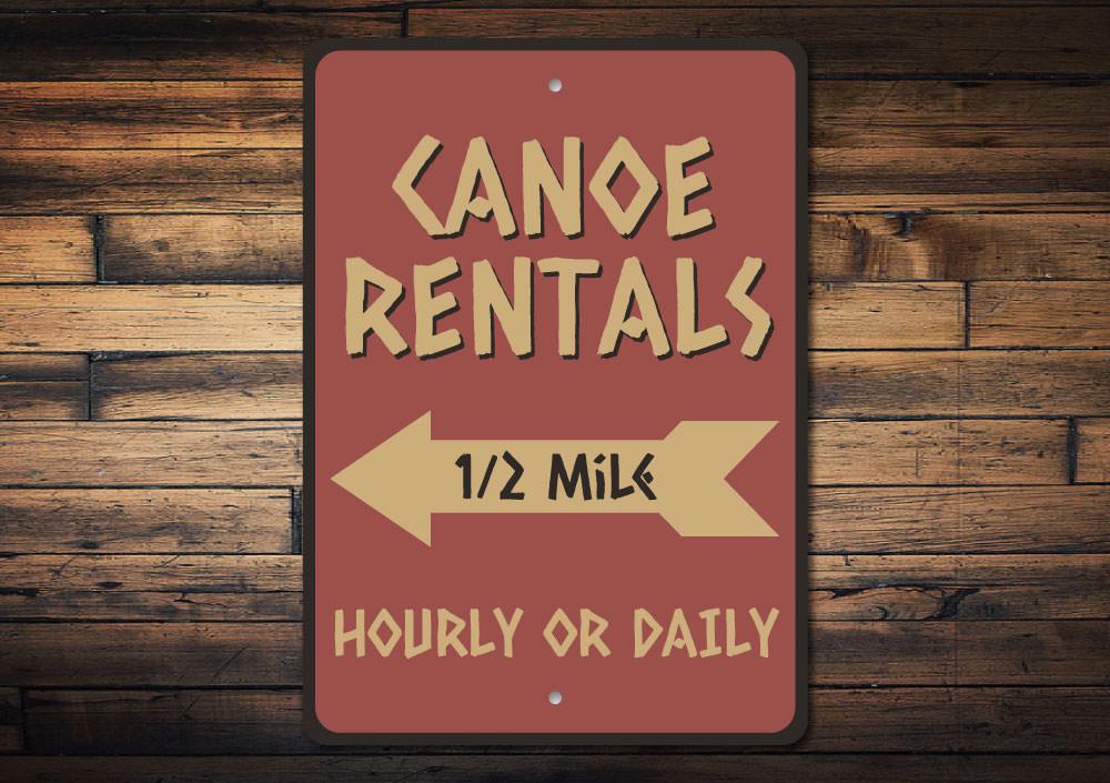 A decorative Canoe Rentals Sign made of high-quality aluminum, featuring customizable text, perfect for lakehouse decor.