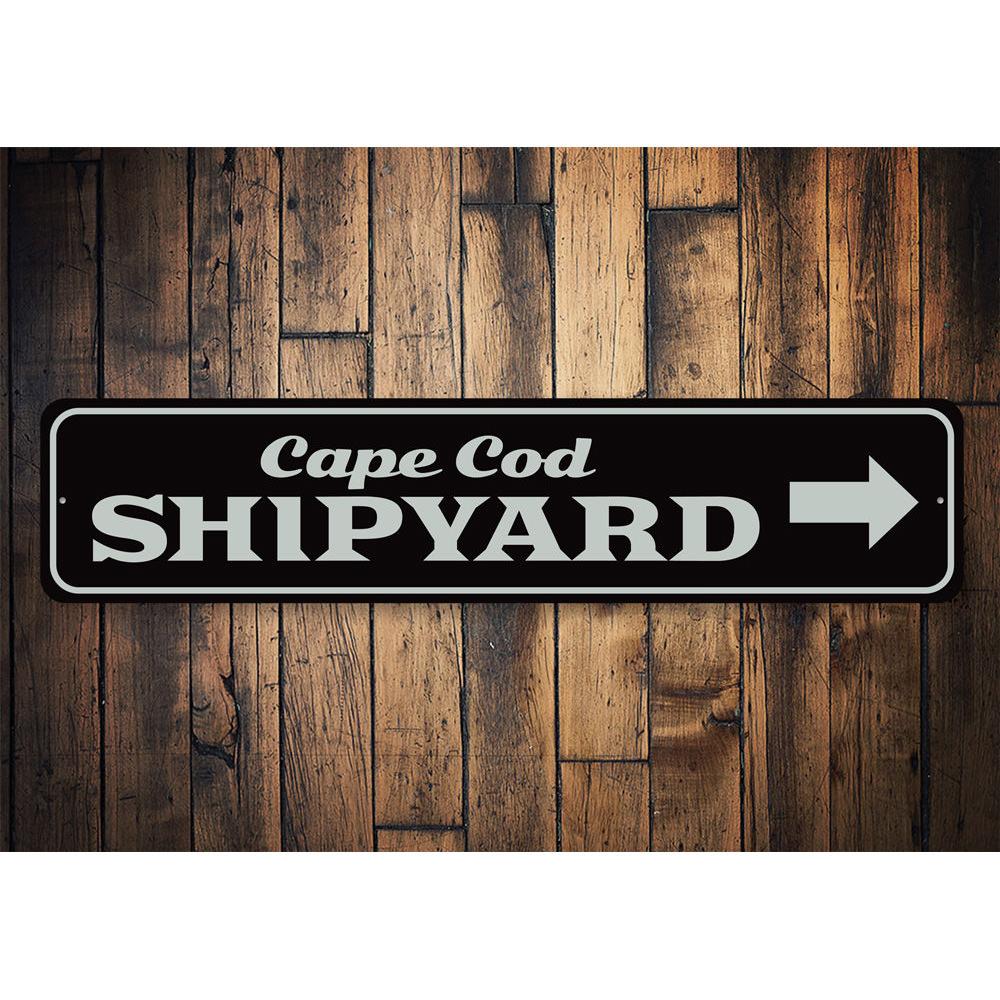 Cape Cod Shipyard Sign made of high-quality aluminum, featuring customizable text and pre-drilled holes for easy mounting.