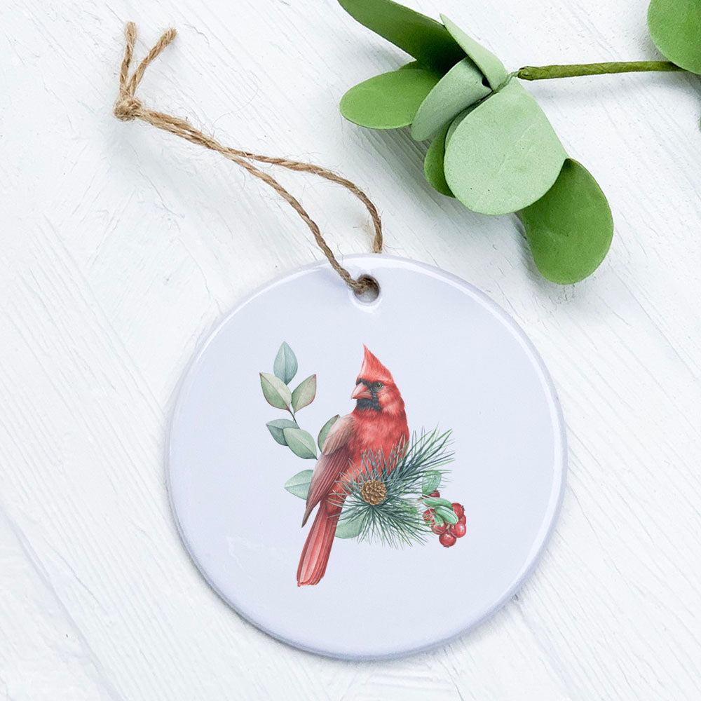 A beautifully crafted Cardinal ornament made of high-quality porcelain, featuring vibrant colors and a smooth glossy finish, perfect for holiday decor.