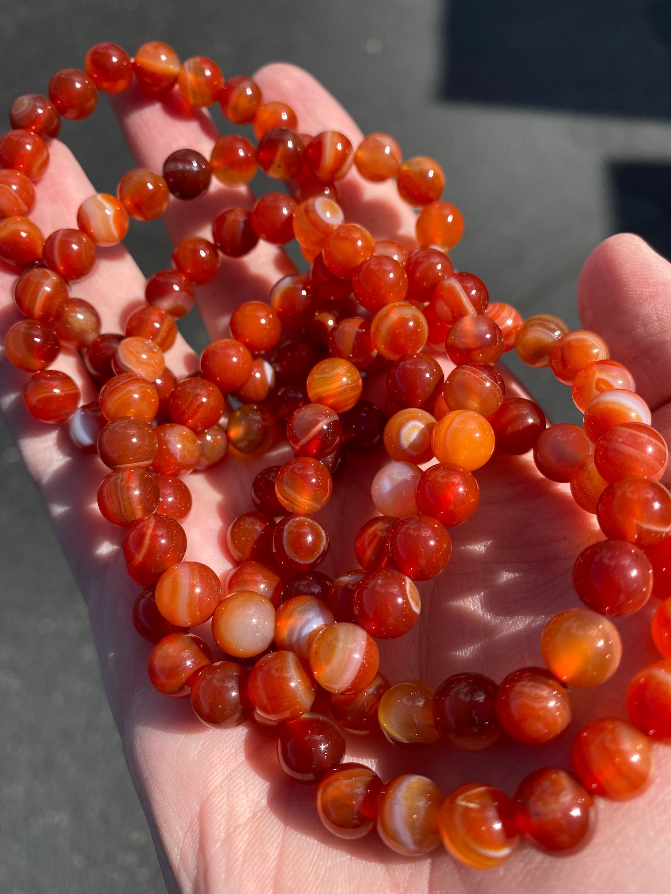 A beautiful Carnelian 8mm bracelet showcasing vibrant orange beads, symbolizing energy and creativity.