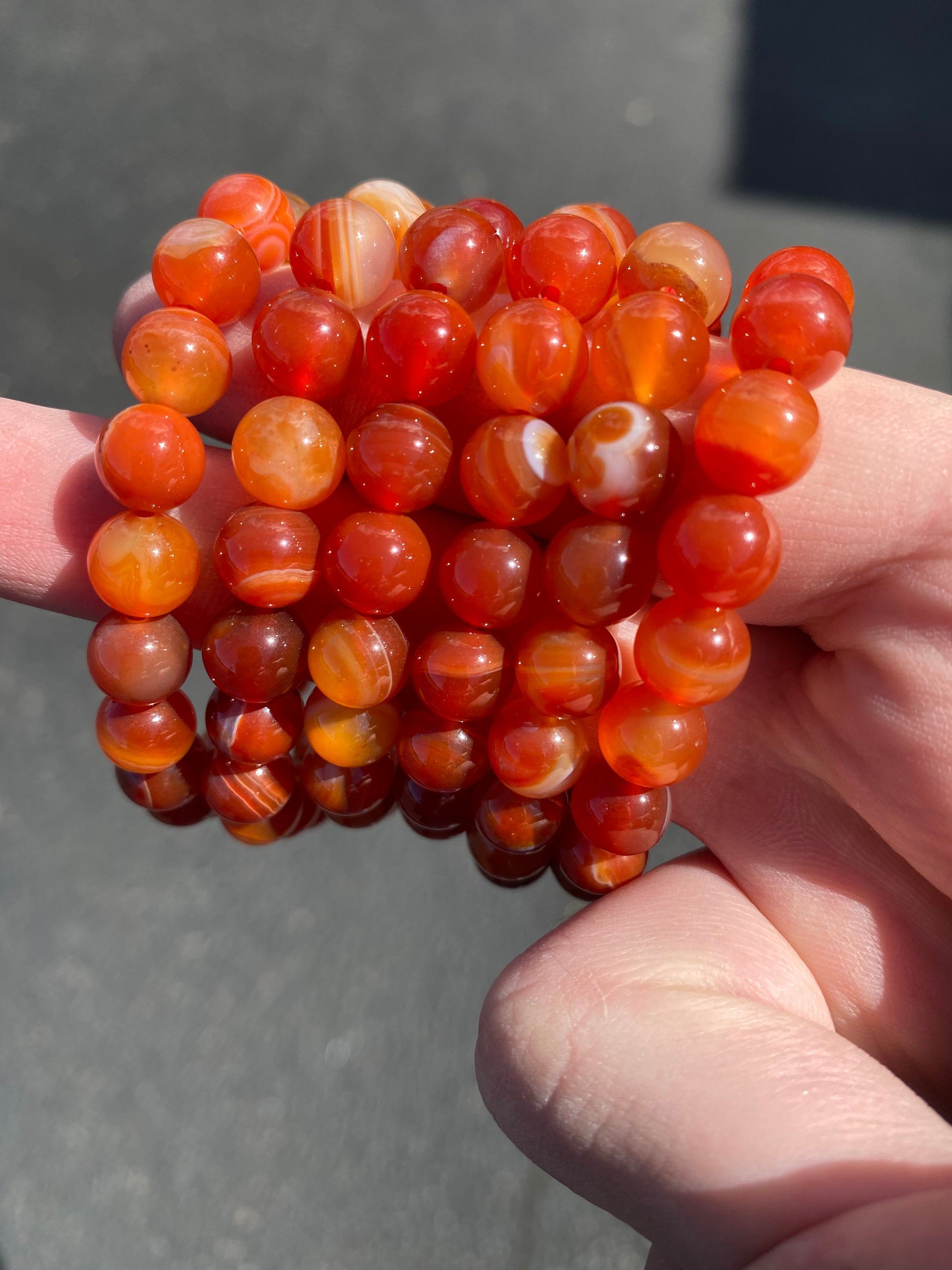 A beautiful Carnelian 8mm bracelet showcasing vibrant orange beads, symbolizing energy and creativity.