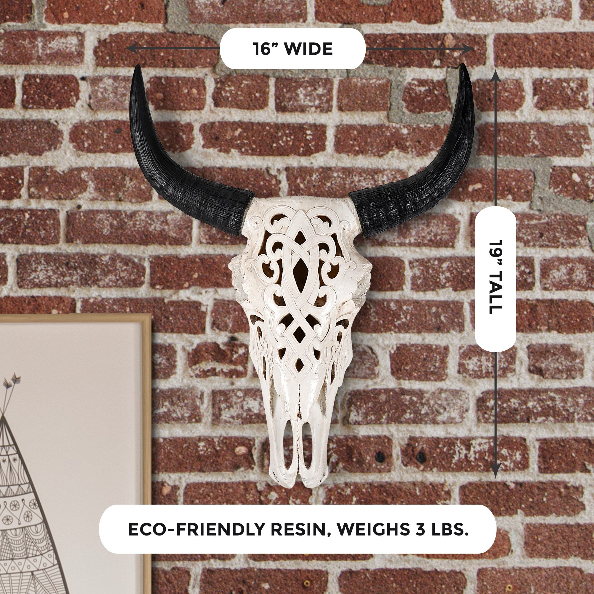 A beautifully hand-painted 19-inch carved faux steer skull made from eco-friendly resin, showcasing intricate engravings and a rustic design.