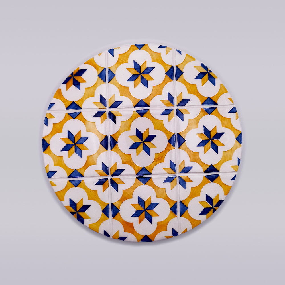 Cascais Ceramic Hot Plate Trivet featuring intricate hand-painted designs and a sleek, elegant shape, perfect for protecting surfaces from heat.