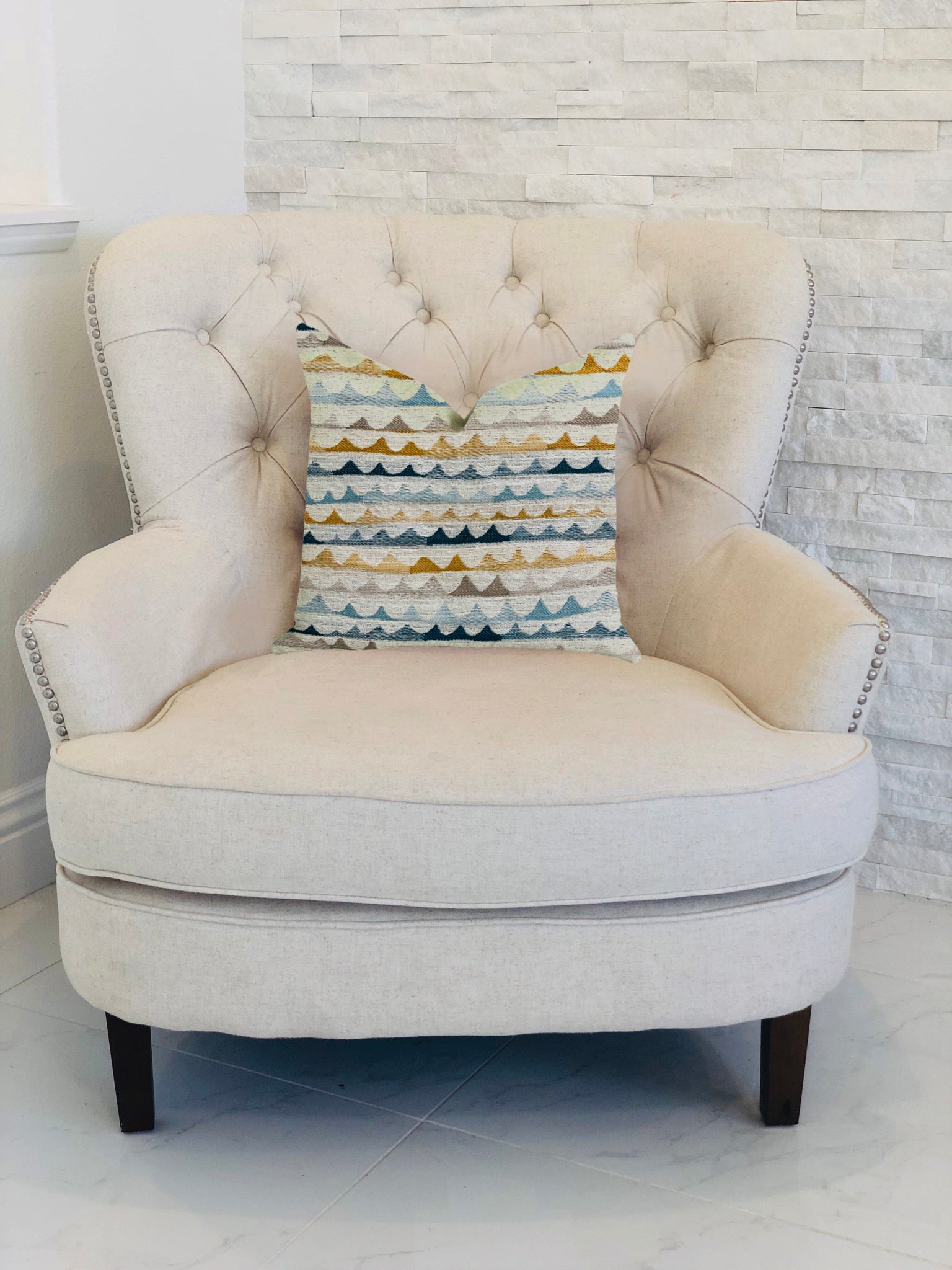 Caspian Rush patterned luxury throw pillow in brown, blue, and gray, showcasing elegant design and high-quality fabric.