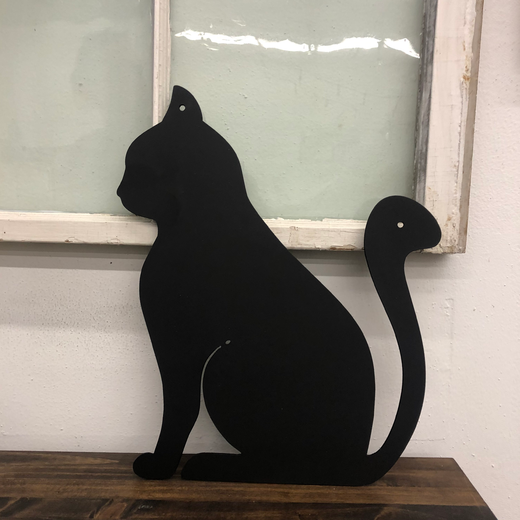 Elegant black metal wall art featuring a cat design, perfect for home decor.