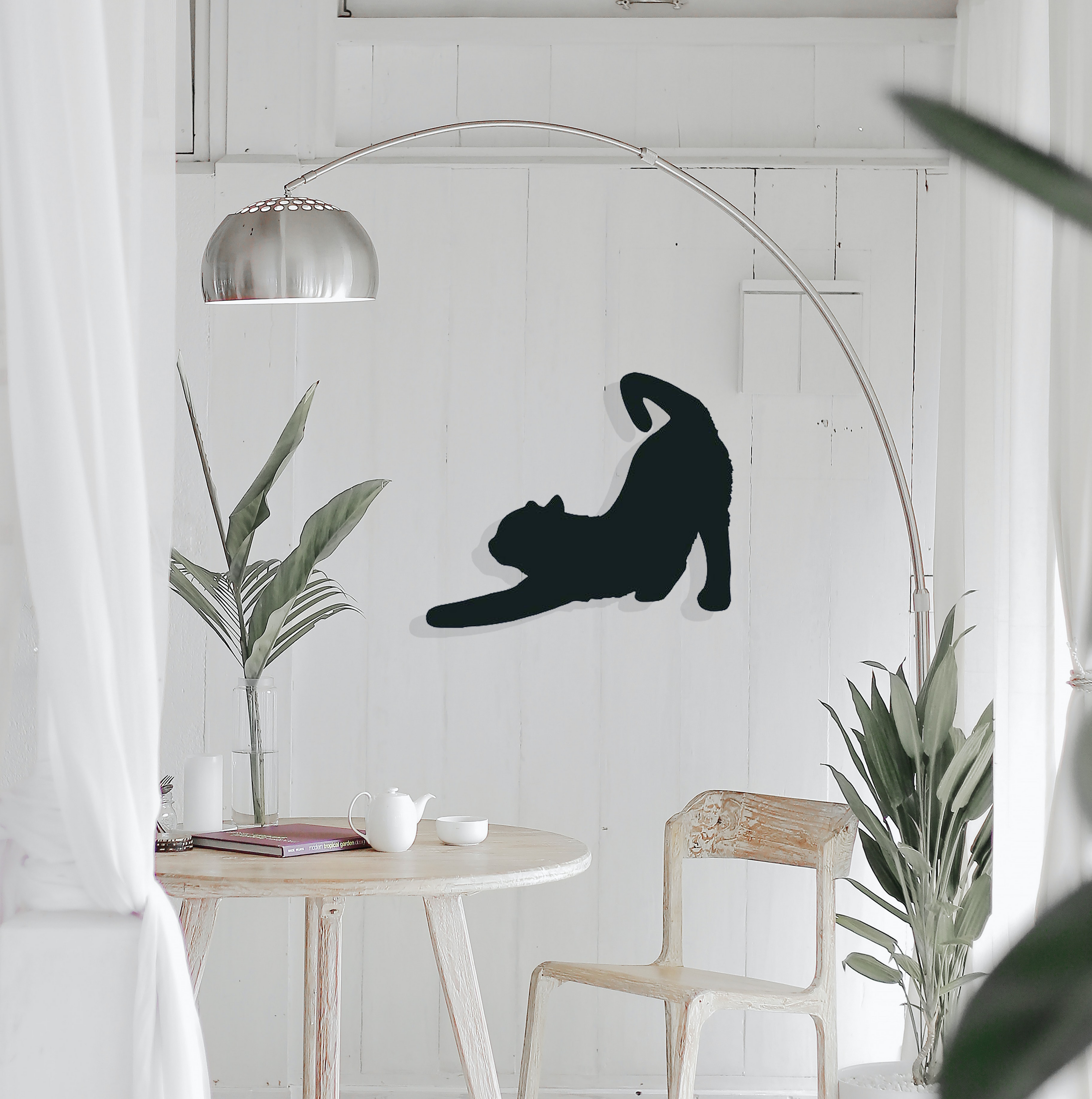 Cat Stretching Metal Wall Art showcasing a sleek design in high-quality steel, perfect for home decor.