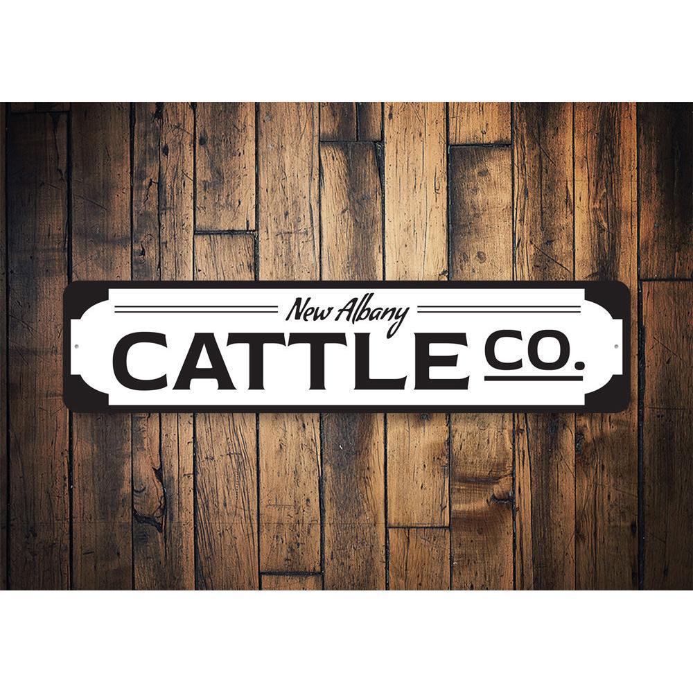 A custom Cattle Company Sign made of high-quality aluminum, featuring a rustic design suitable for home or business decor.