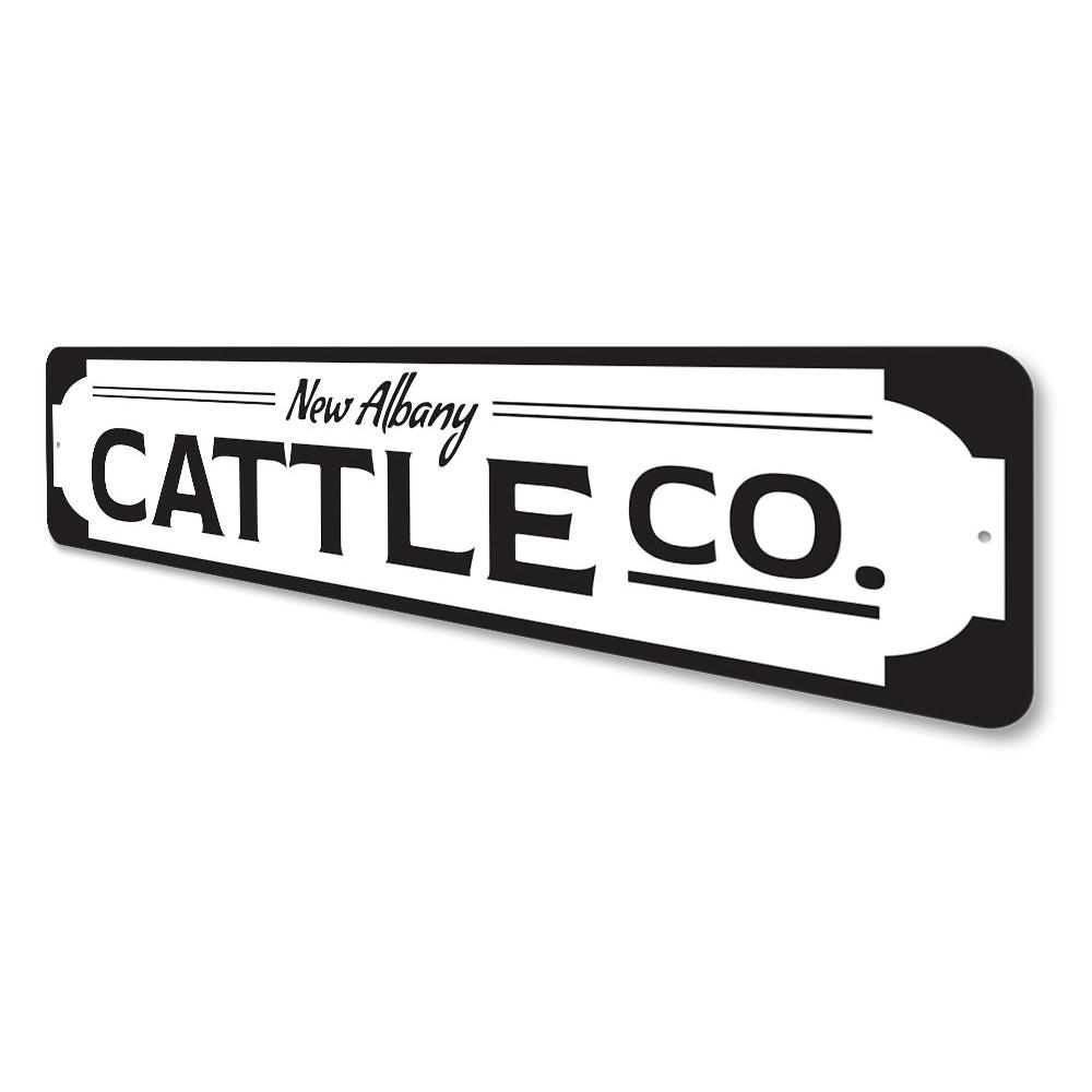 A custom Cattle Company Sign made of high-quality aluminum, featuring a rustic design suitable for home or business decor.