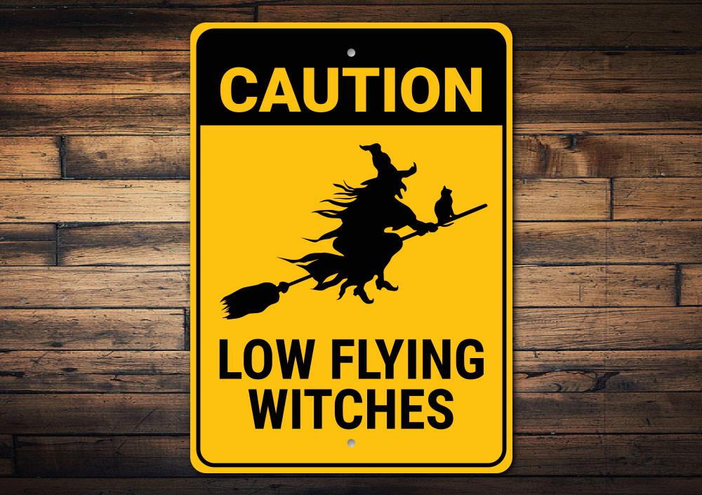 Caution Low Flying Witches Sign made of durable aluminum, featuring whimsical design perfect for home decor.