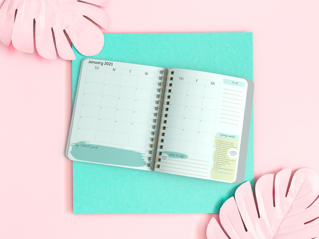 CBT Daily Planner featuring a glossy cover, spiral binding, and colorful pages for effective daily planning and reflection.