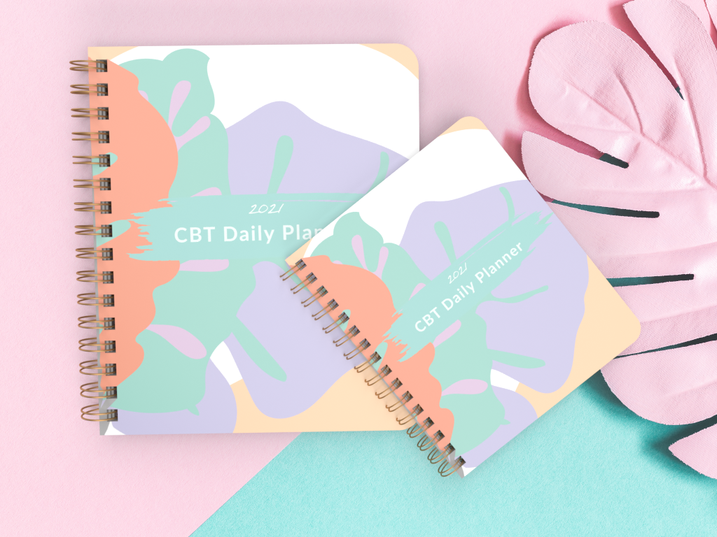 CBT Daily Planner featuring a glossy cover, spiral binding, and colorful pages for effective daily planning and reflection.