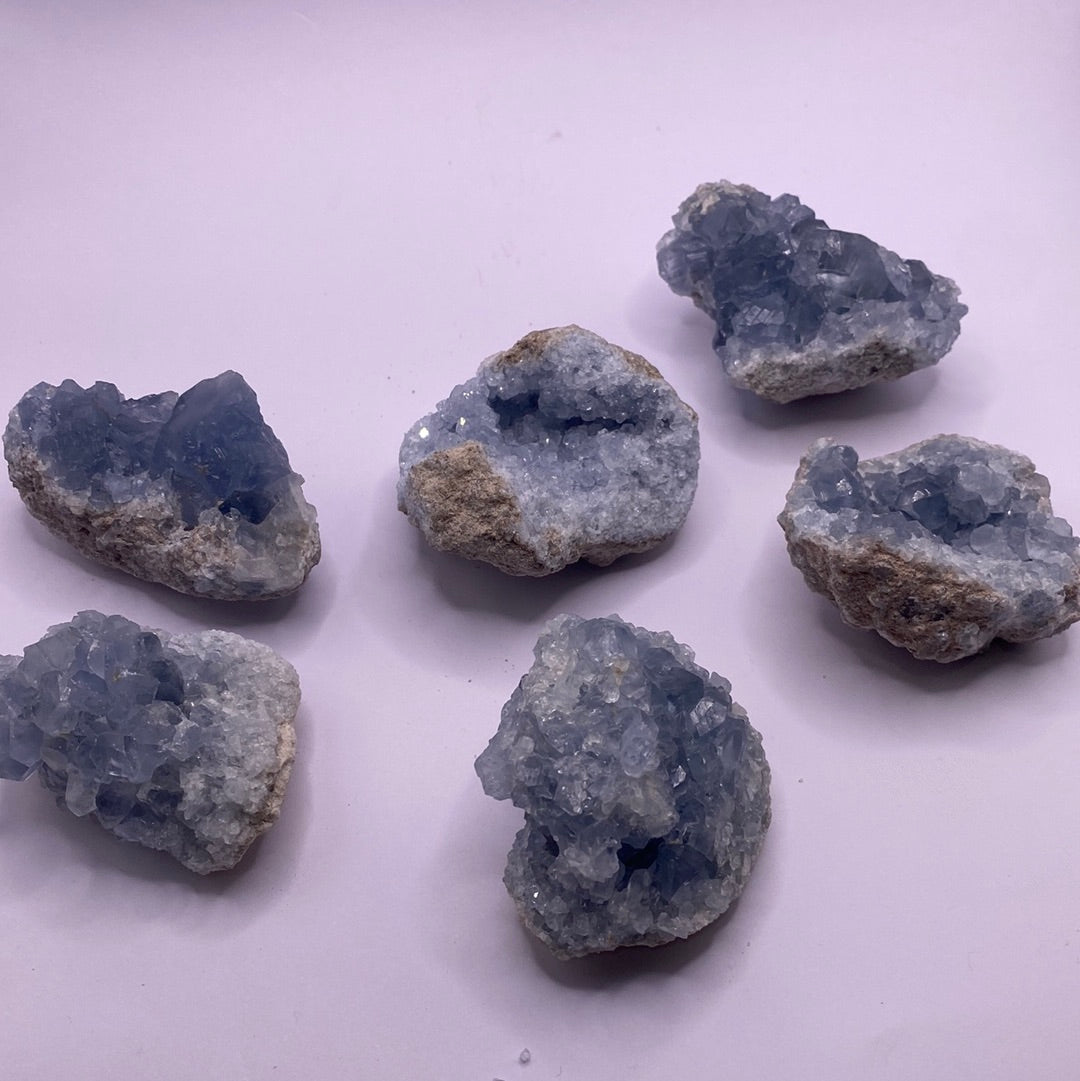 A beautiful Celestite geode chunk showcasing its vibrant blue color and natural crystal formations.