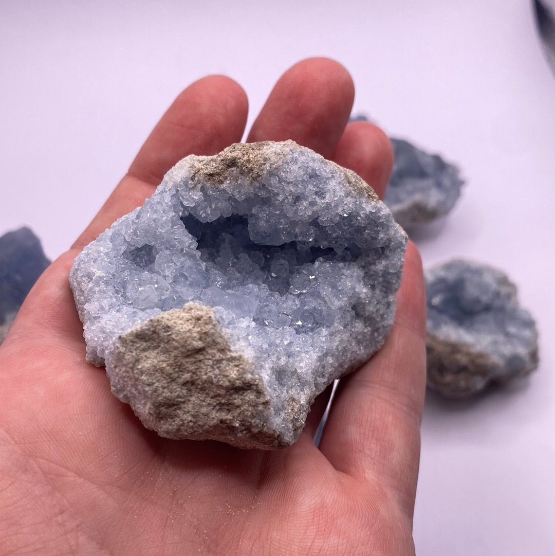 A beautiful Celestite geode chunk showcasing its vibrant blue color and natural crystal formations.