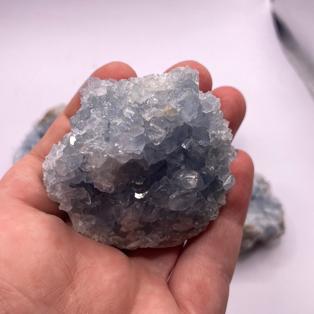 A beautiful Celestite geode chunk showcasing its vibrant blue color and natural crystal formations.