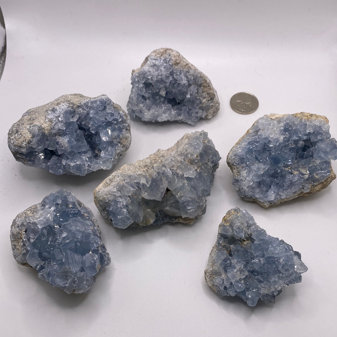 Large Celestite Geodes showcasing beautiful blue crystals, perfect for enhancing intuition and emotional balance.