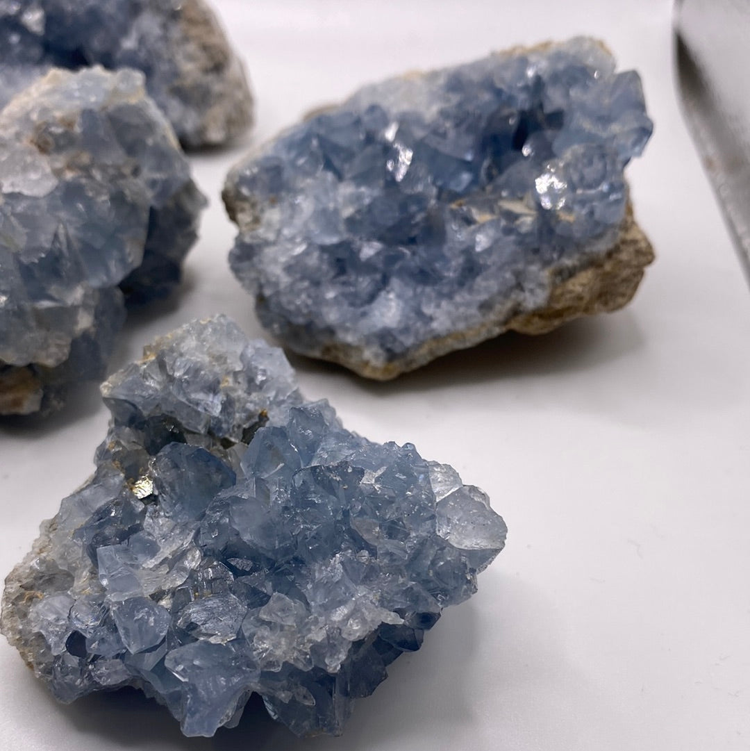 Large Celestite Geodes showcasing beautiful blue crystals, perfect for enhancing intuition and emotional balance.