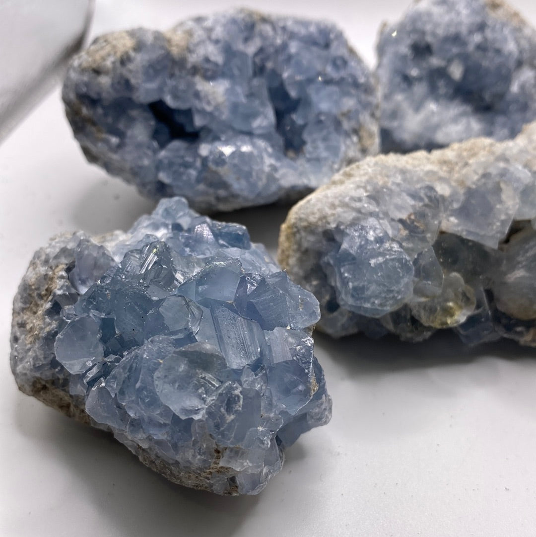 Large Celestite Geodes showcasing beautiful blue crystals, perfect for enhancing intuition and emotional balance.