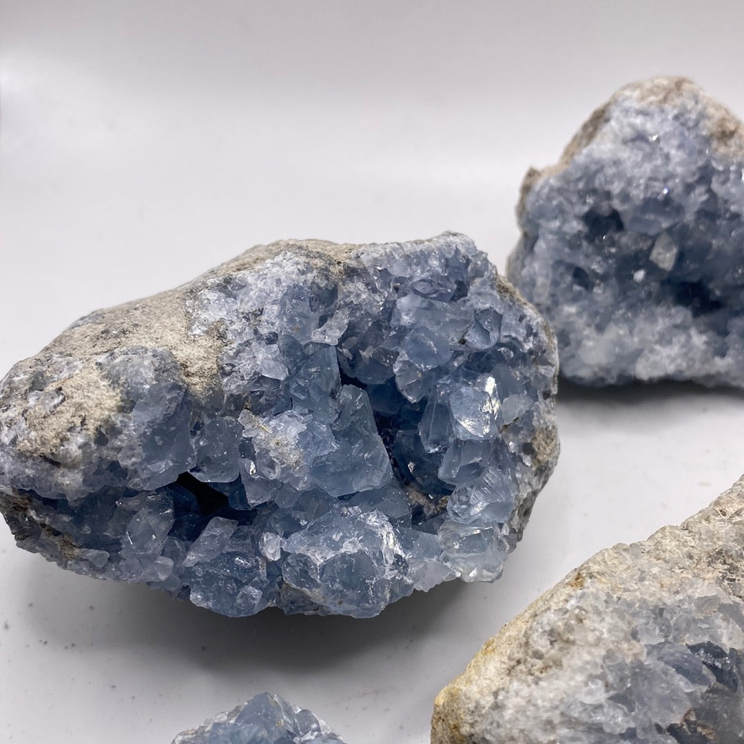 Large Celestite Geodes showcasing beautiful blue crystals, perfect for enhancing intuition and emotional balance.